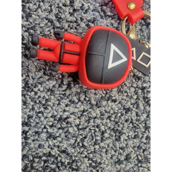 Squid Game-Inspired Red Silicone Keychain With Figure & Symbols - Picture 2 of 3